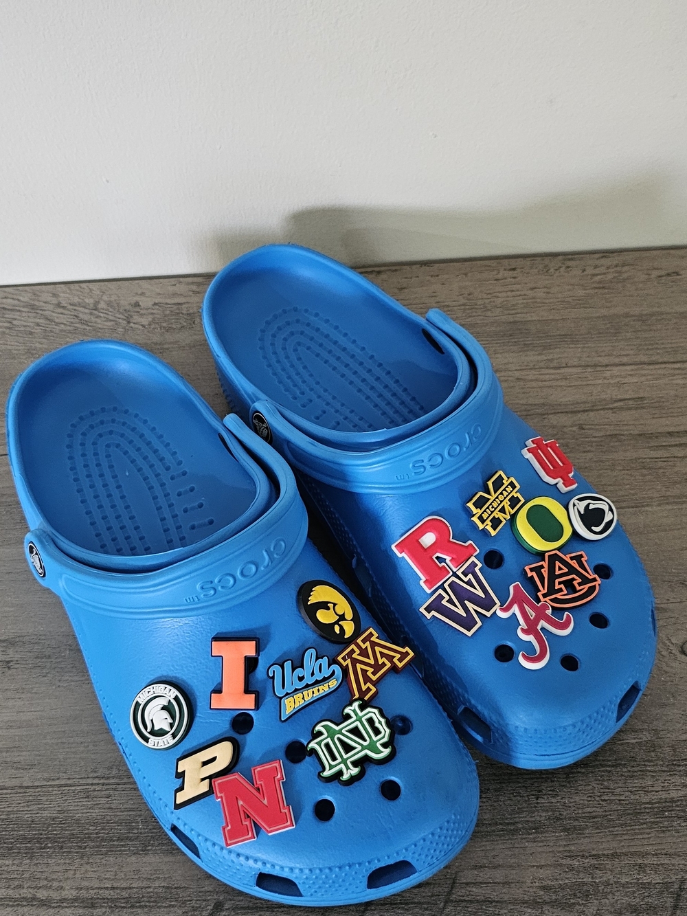 Crocs Classic Clog in Blue with College Football Charms Women 11 Men 9